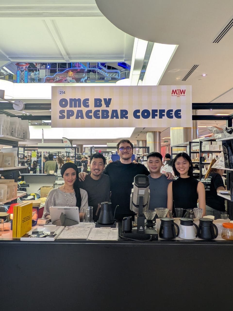 The Ome by Spacebar Coffee team behind the bar at a coffee event